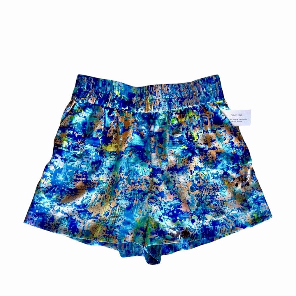 Blue and multicolor patterned shorts on a white background