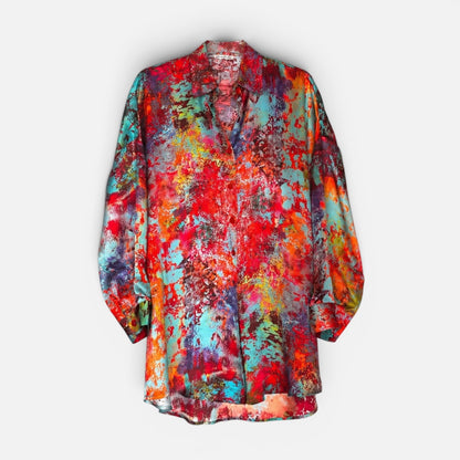 Colorful abstract patterned shirt on a white background