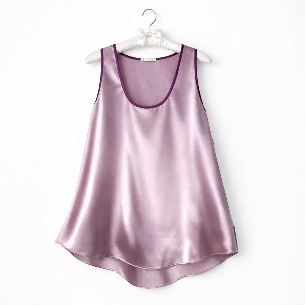 Dusty rose  silk satin top on hanger against a white background 