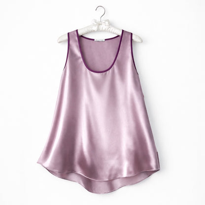 Dusty rose  silk satin top on hanger against a white background 