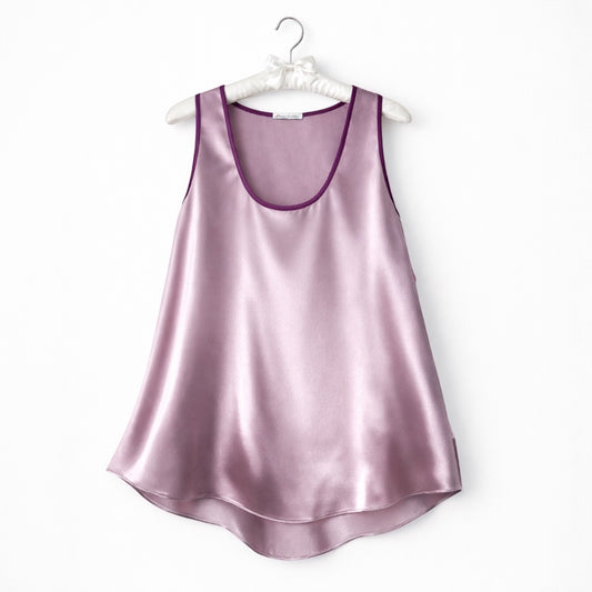 Dusty rose  silk satin top on hanger against a white background 