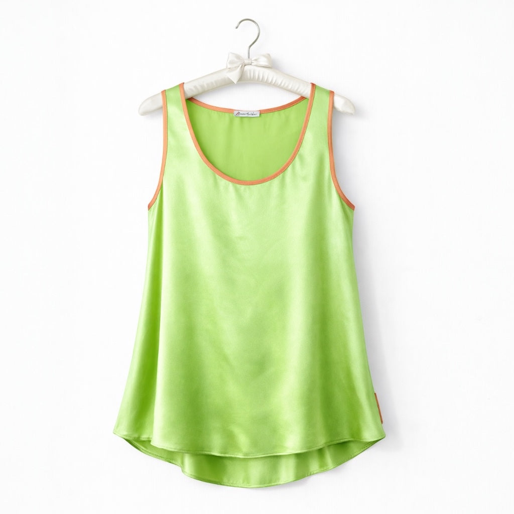 Green tank top with orange trim on a white hanger against a white background