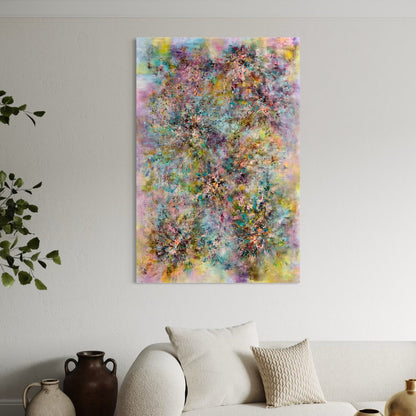 Colorful abstract painting on a wall above a sofa with decorative pillows.