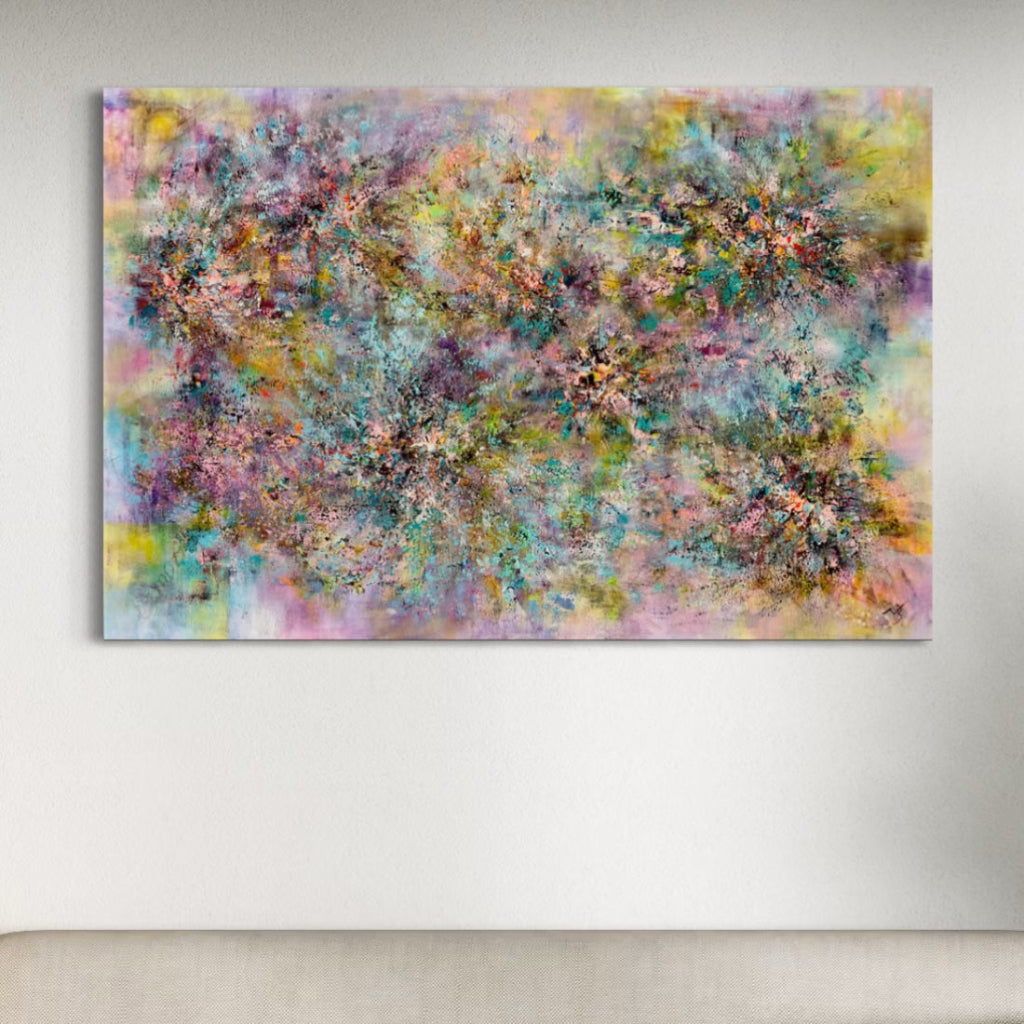 Abstract painting with multicolored splashes on a white wall