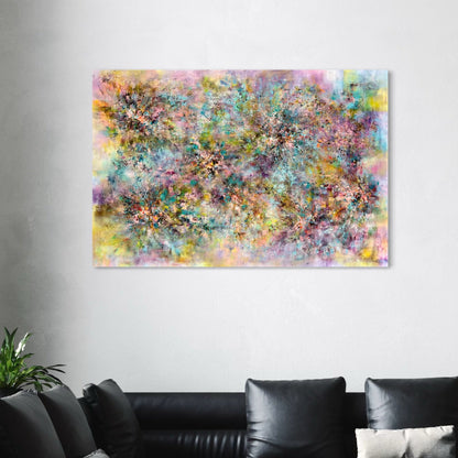 Abstract multicolored painting on a wall above a black leather sofa.