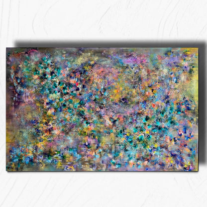 An abstract rectangular canvas painting with a textured, expressive brushstroke pattern in a mix of blue, green, purple, yellow, and gray tones, displayed against a light gray wall.