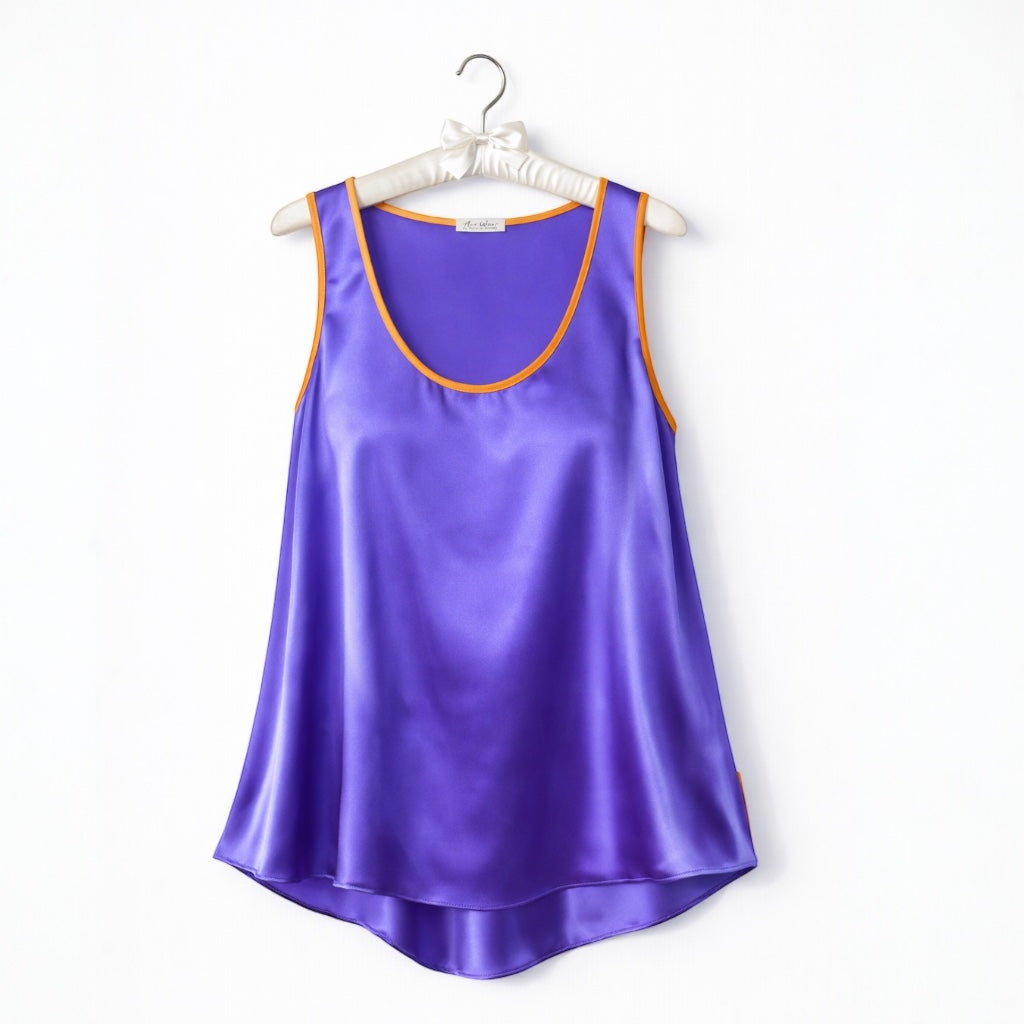 Purple satin tank top on a white hanger with a white background
