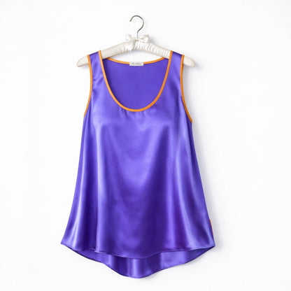 Purple satin tank top on a white hanger with a white background