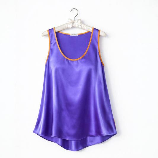 Purple satin tank top on a white hanger with a white background