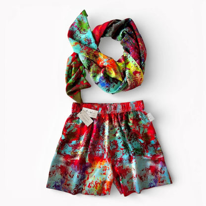 Red silk satin shorts and scarf set on a white background