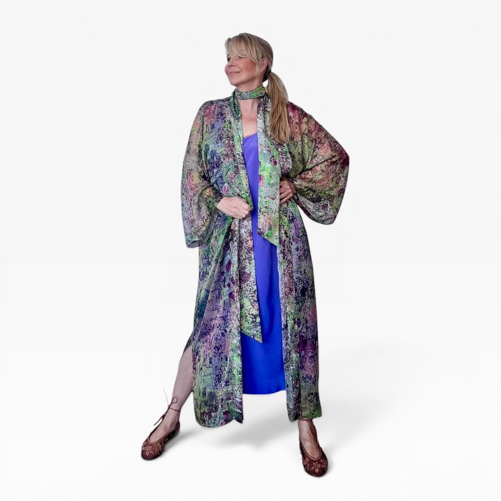 woman wears green chiffon silk kimono over purple dress