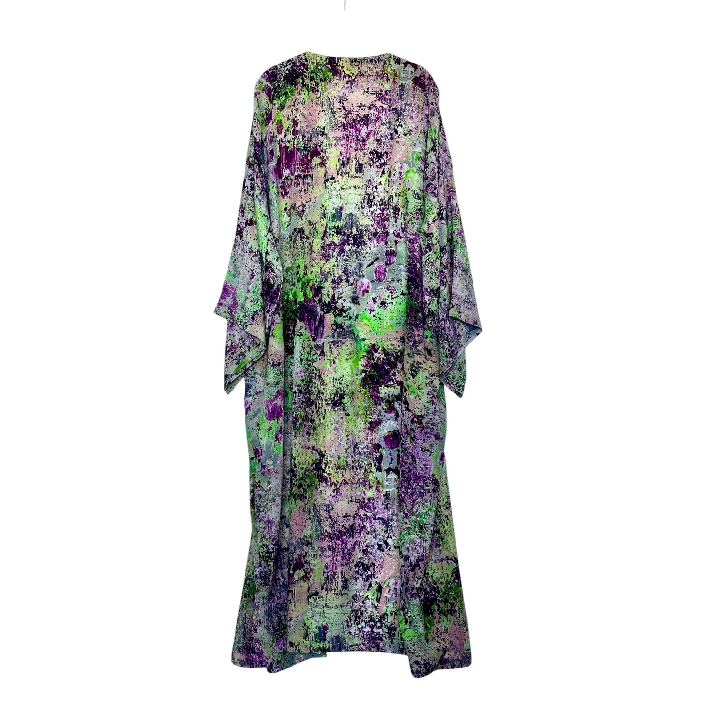 Floral patterned dress with green and purple tones on a white background