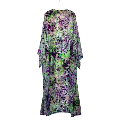 Floral patterned dress with green and purple tones on a white background