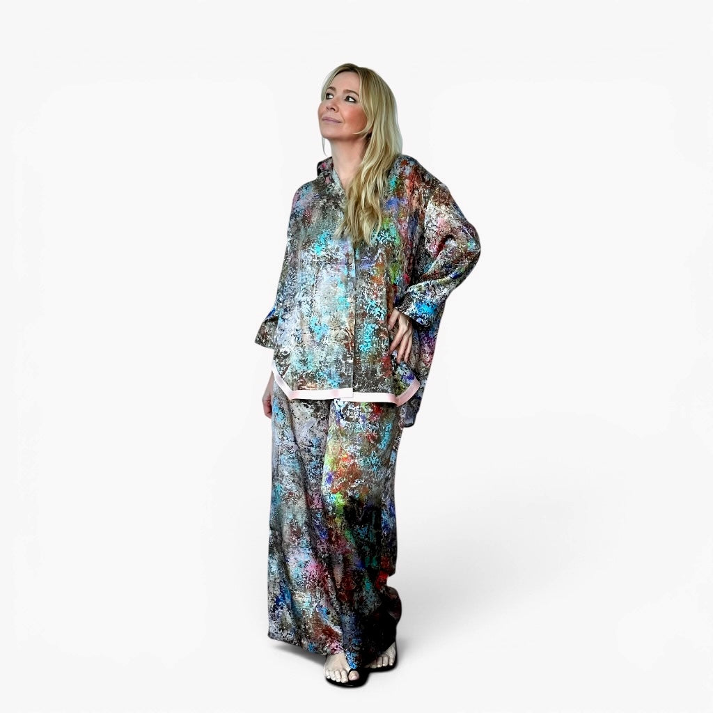 Woman wearing a colorful outfit on a white background