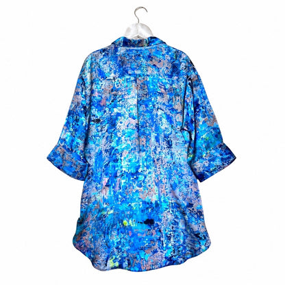 Blue floral patterned shirt on a white hanger