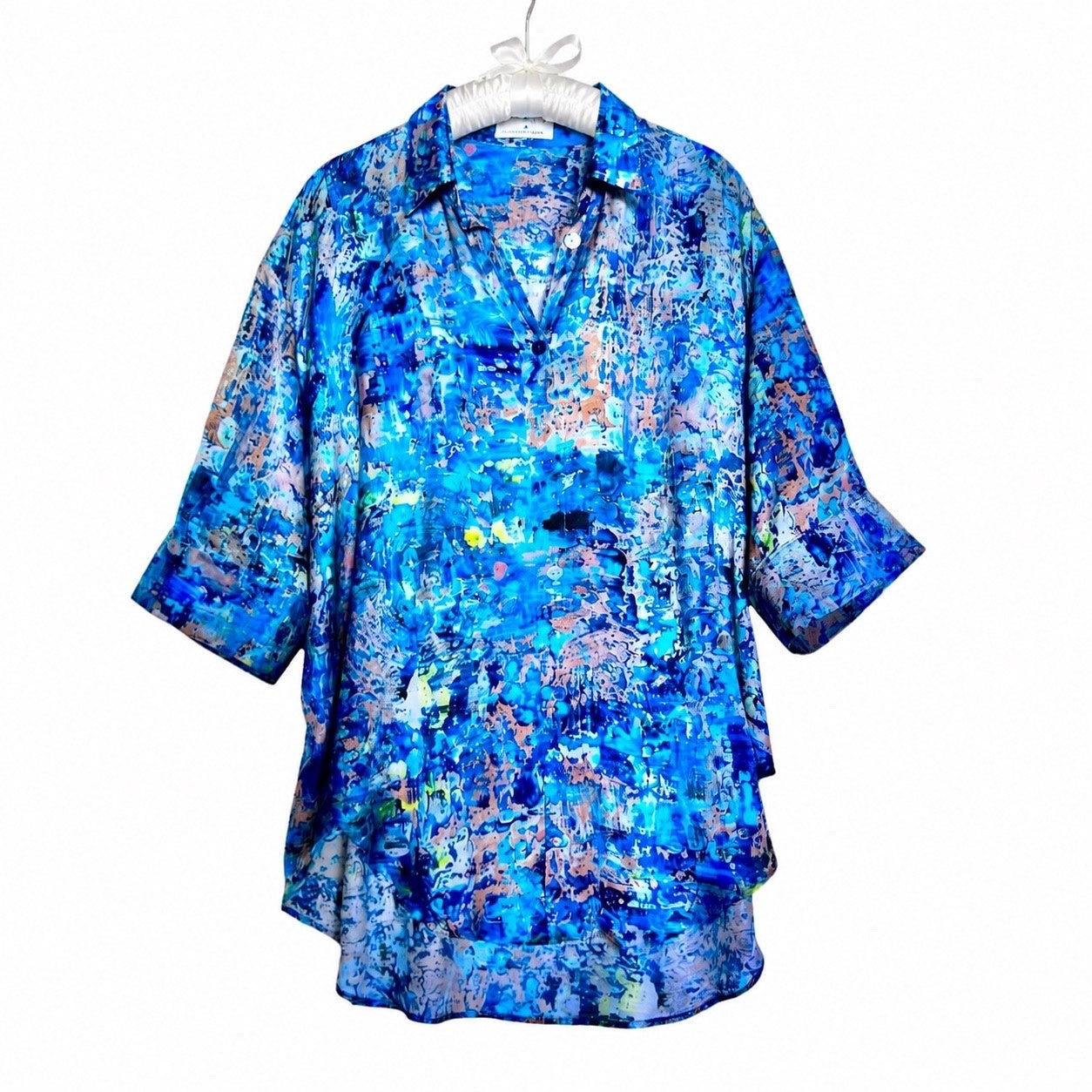Blue abstract patterned shirt on a white hanger
