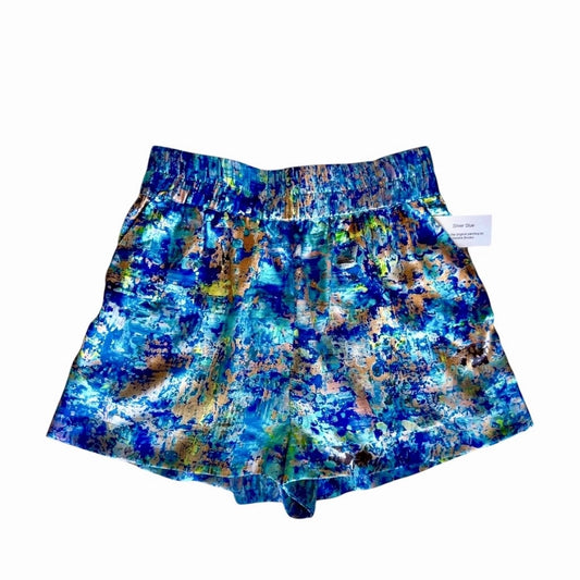 Blue and multicolor patterned shorts on a white background