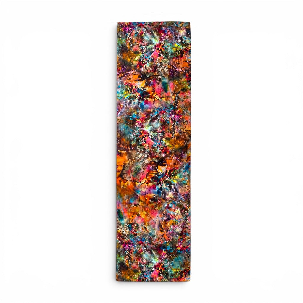 A tall, narrow rectangular silk stole featuring an abstract, multicolored paint-splatter design with vibrant shades of orange, red, blue, green, and yellow, displayed against a clean white background.