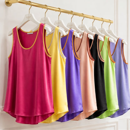 silk tops multiple colours  hanging on a rack in a boutique