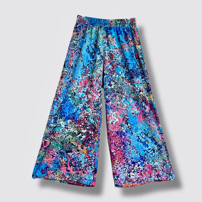 Colorful floral-patterned pants on a light gray background