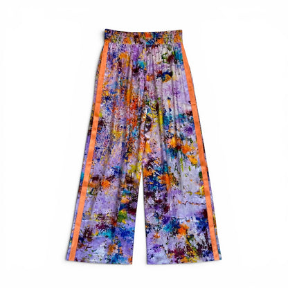 Colorful patterned pants with orange stripes on a white background