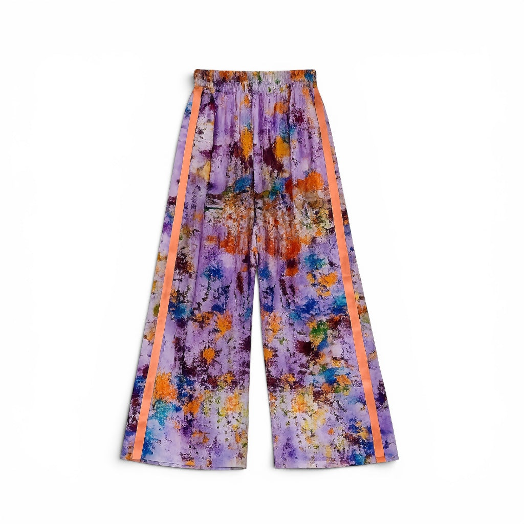 Colorful pants with abstract pattern and orange stripes on a white background