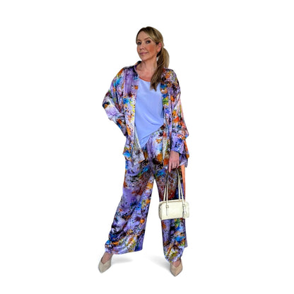 Woman wearing a colorful outfit with a white background