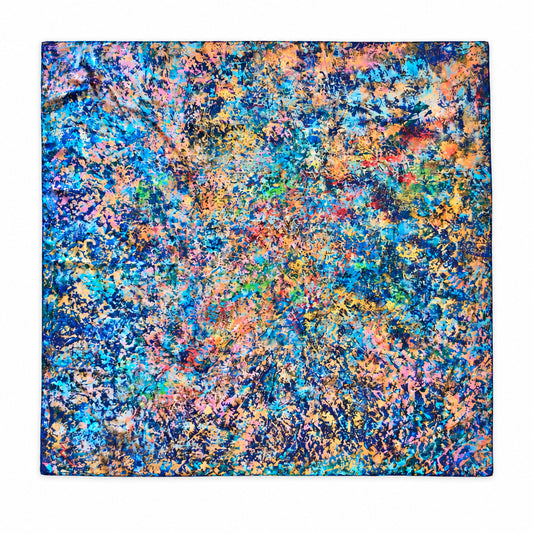 A square fabric scarf featuring an abstract, multicolored textured pattern with blue, orange, pink, yellow, and green tones, displayed flat against a white background.